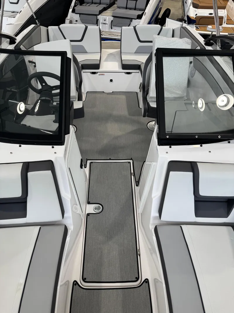Slide: The Image of 2025 Yamaha Boats SX220 interior with modern seating and sleek design. - 11