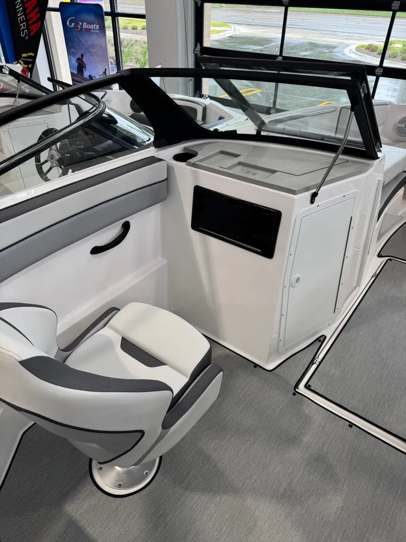 Slide: The Image of 2025 Yamaha Boats SX220 interior with sleek seating and modern dashboard design. - 6