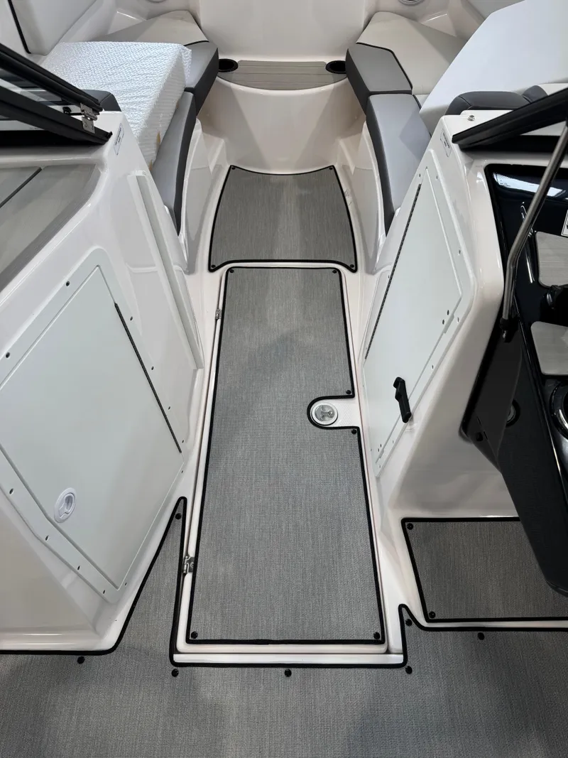Slide: The Image of 2025 Yamaha Boats SX220 interior with sleek seating and modern design. - 8