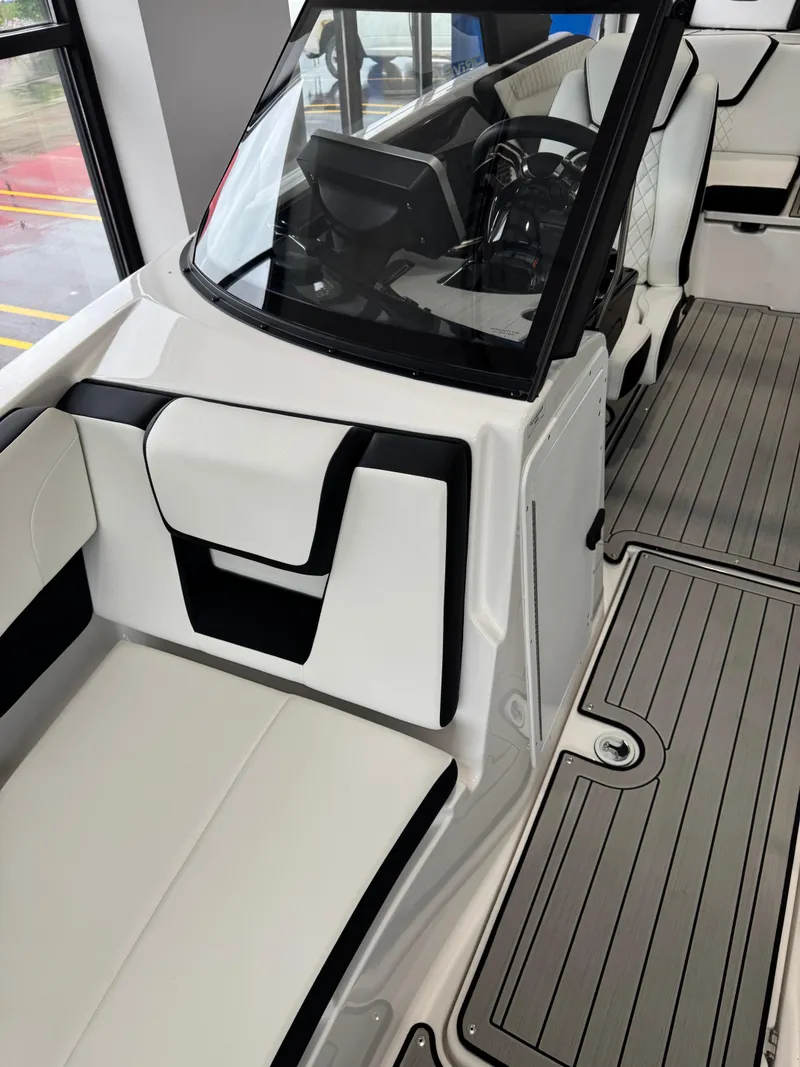 Slide: The Image of 2025 Yamaha Boats 222SD interior with sleek seating and modern dashboard design. - 13