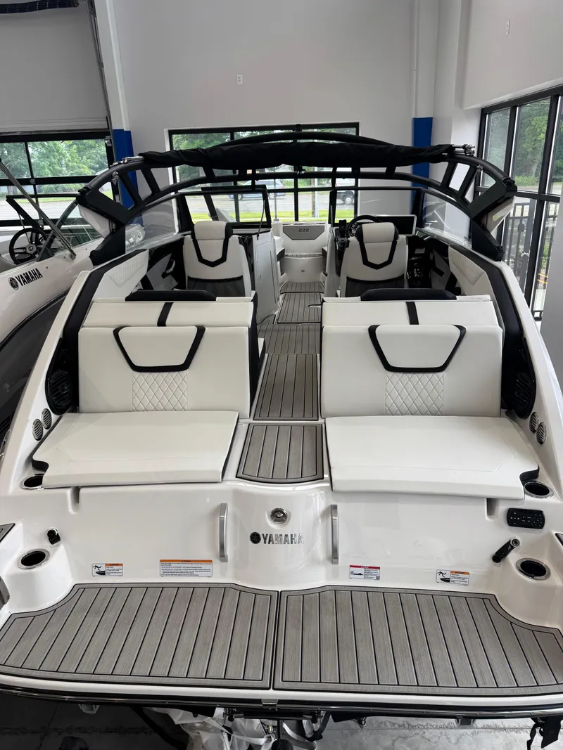 Slide: The Image of 2025 Yamaha Boats 222SD interior with sleek white seating and modern design. - 3