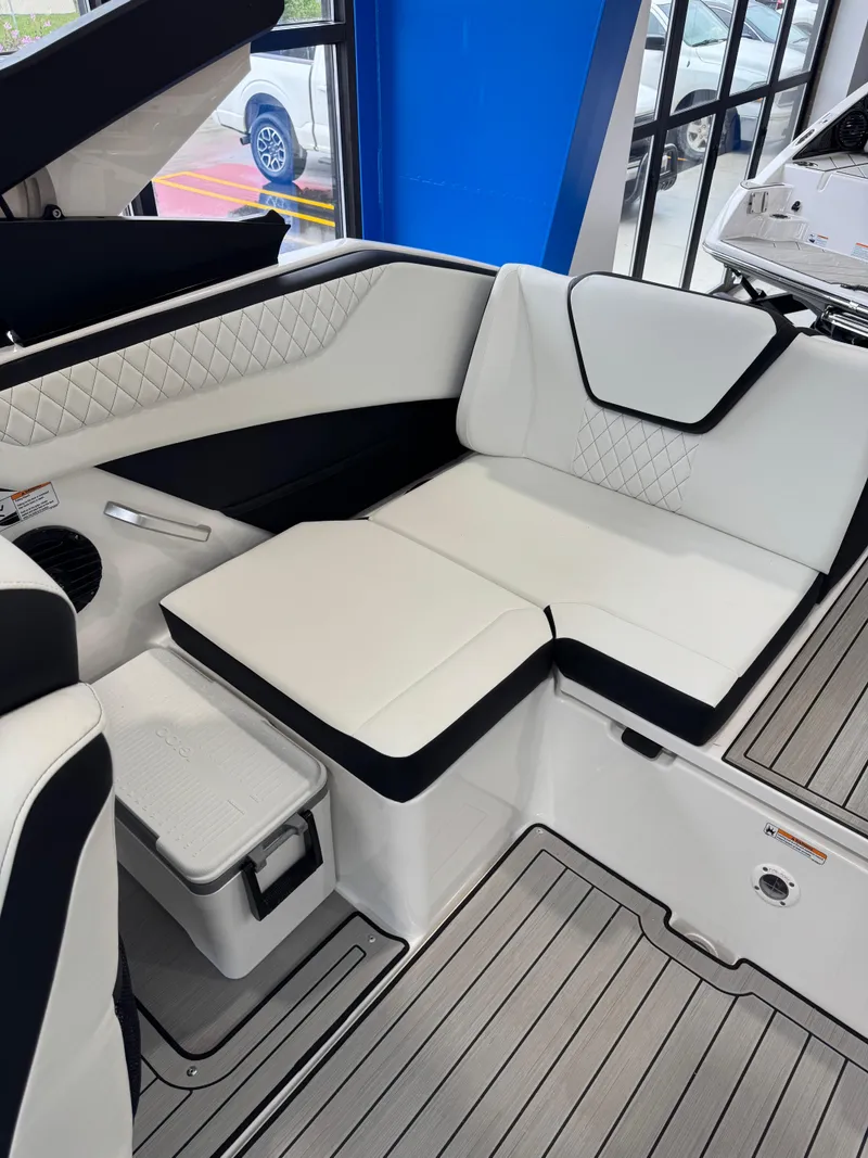 Slide: The Image of 2025 Yamaha Boats 222SD interior with white and black seating, modern design, and sleek flooring. - 5