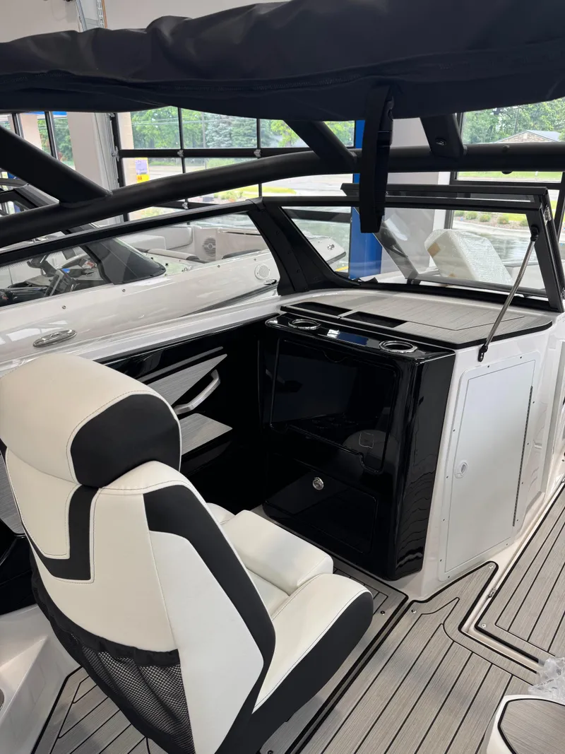 Slide: The Image of 2025 Yamaha Boats 222SD interior with sleek seating and modern dashboard design. - 9