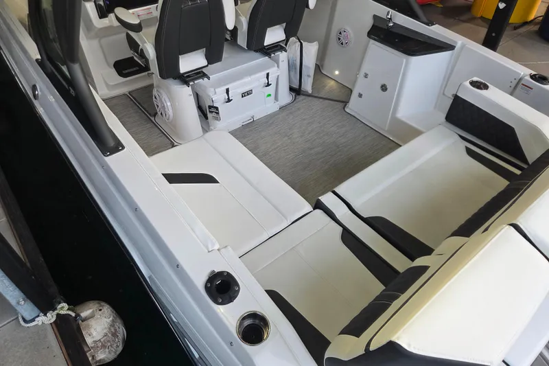 Slide: The Image of Interior of 2026 Monterey Elite 27 OB boat with modern seating and storage. - 20