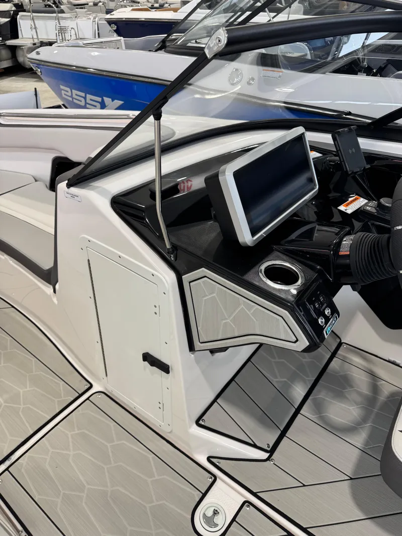 Slide: The Image of 2025 Yamaha Boats 252XE dashboard with modern controls and sleek design. - 14