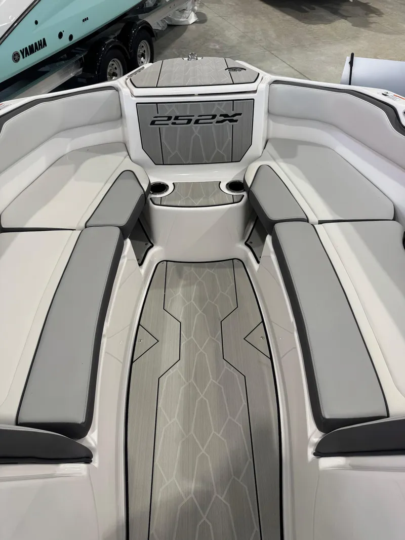 Slide: The Image of 2025 Yamaha Boats 252XE interior with sleek seating and modern design. - 15