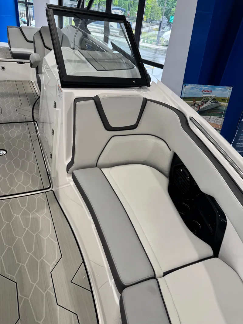 Slide: The Image of 2025 Yamaha Boats 252XE interior with sleek seating and modern design. - 16