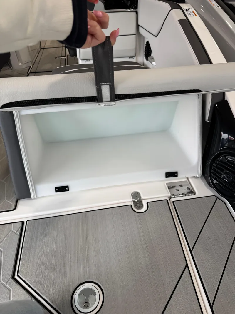 Slide: The Image of 2025 Yamaha Boats 252XE interior storage compartment with sleek design and modern features. - 3