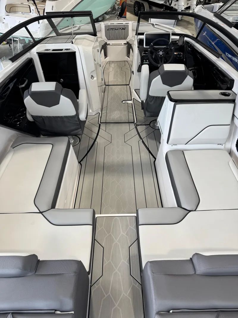 Slide: The Image of 2025 Yamaha Boats 252XE interior with sleek seating and modern design. - 4
