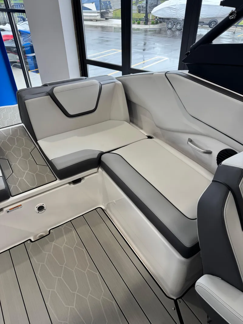 Slide: The Image of 2025 Yamaha Boats 252XE interior seating with modern design and gray accents. - 6