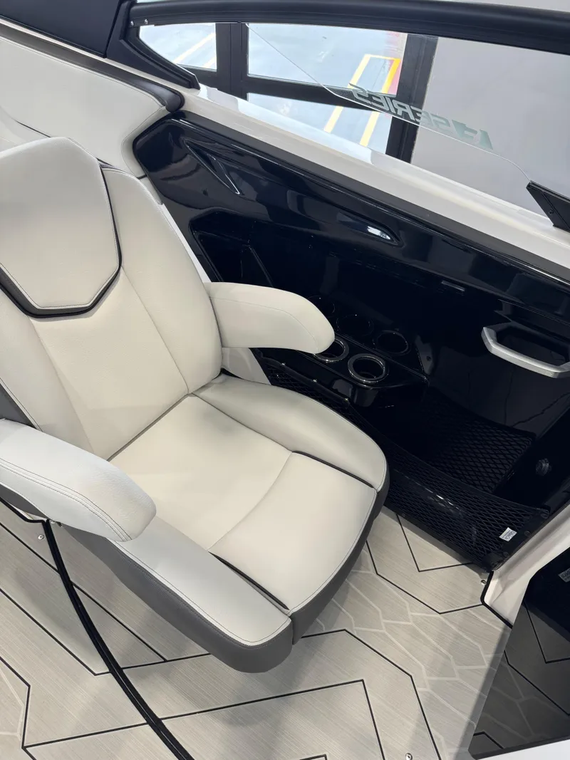 Slide: The Image of Luxurious interior of 2025 Yamaha Boats 252XE, featuring a sleek white captain's chair. - 7