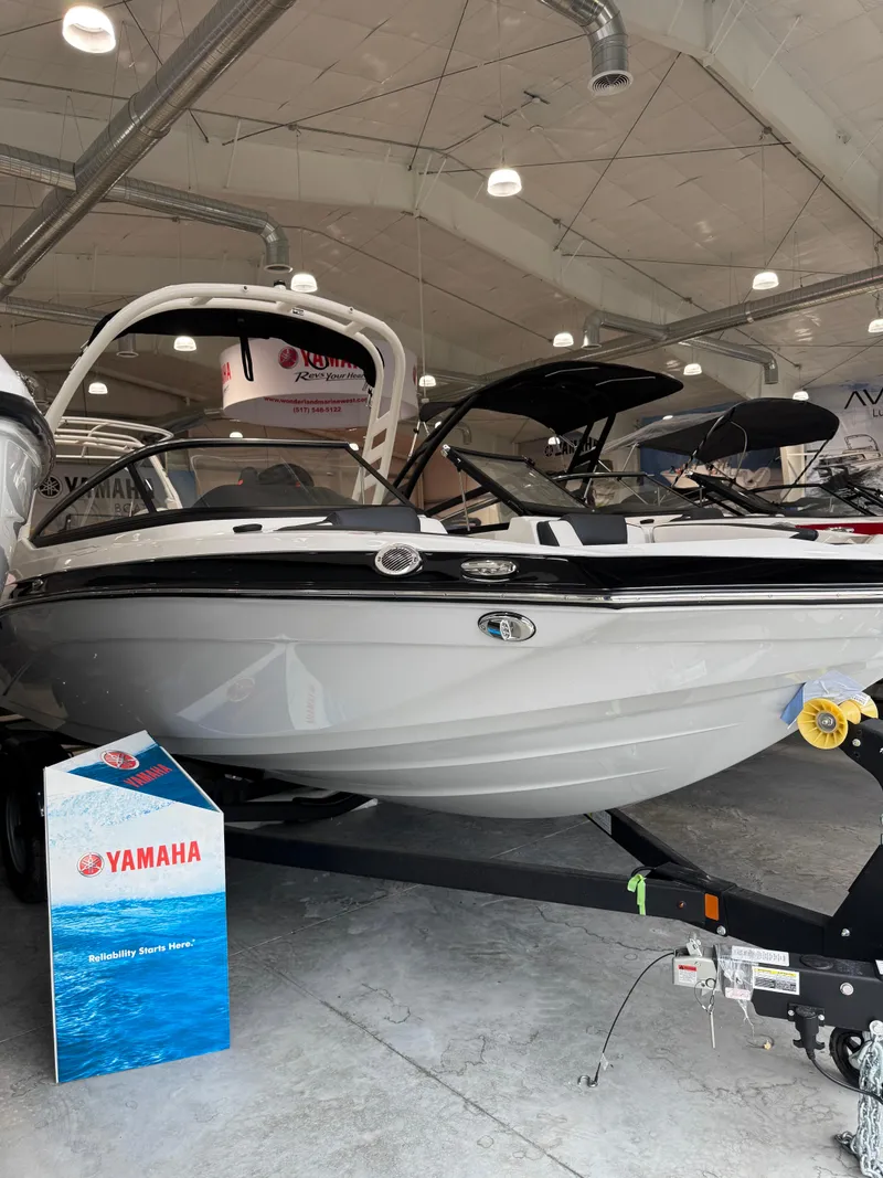 The Image of 2025 Yamaha Boats 195S displayed in a showroom, highlighting sleek design and modern features. - 0