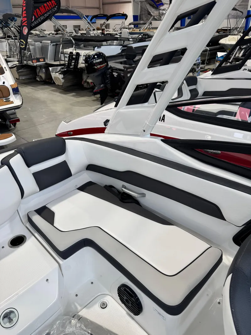 Slide: The Image of 2025 Yamaha Boats 195S interior with sleek seating and modern design in showroom. - 3