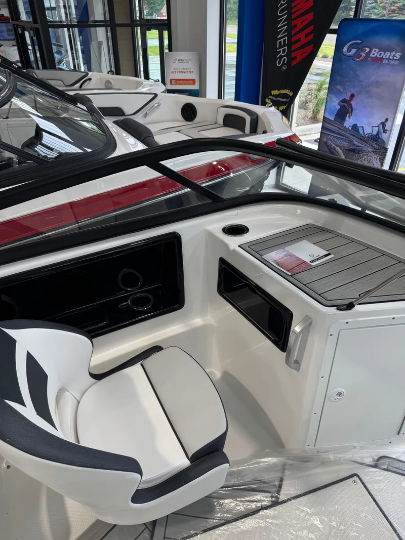 Slide: The Image of Interior of 2025 Yamaha Boats 195S, featuring sleek seating and modern dashboard. - 4