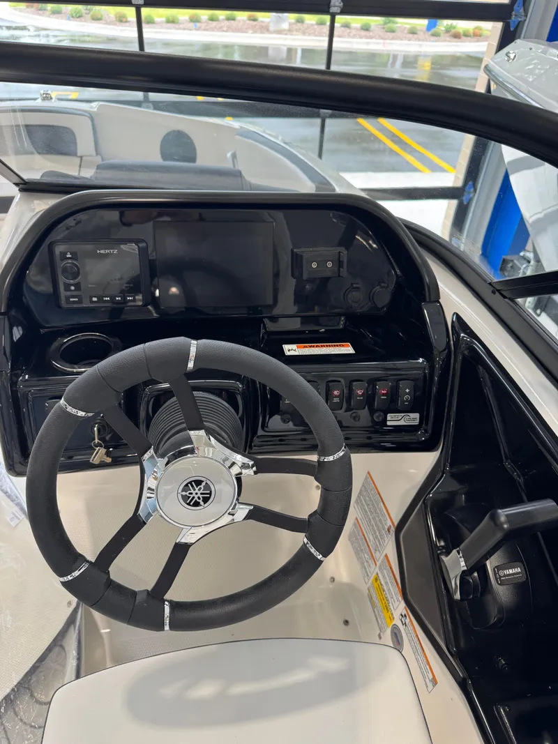Slide: The Image of 2025 Yamaha Boats 195S dashboard with steering wheel and control panel. - 5