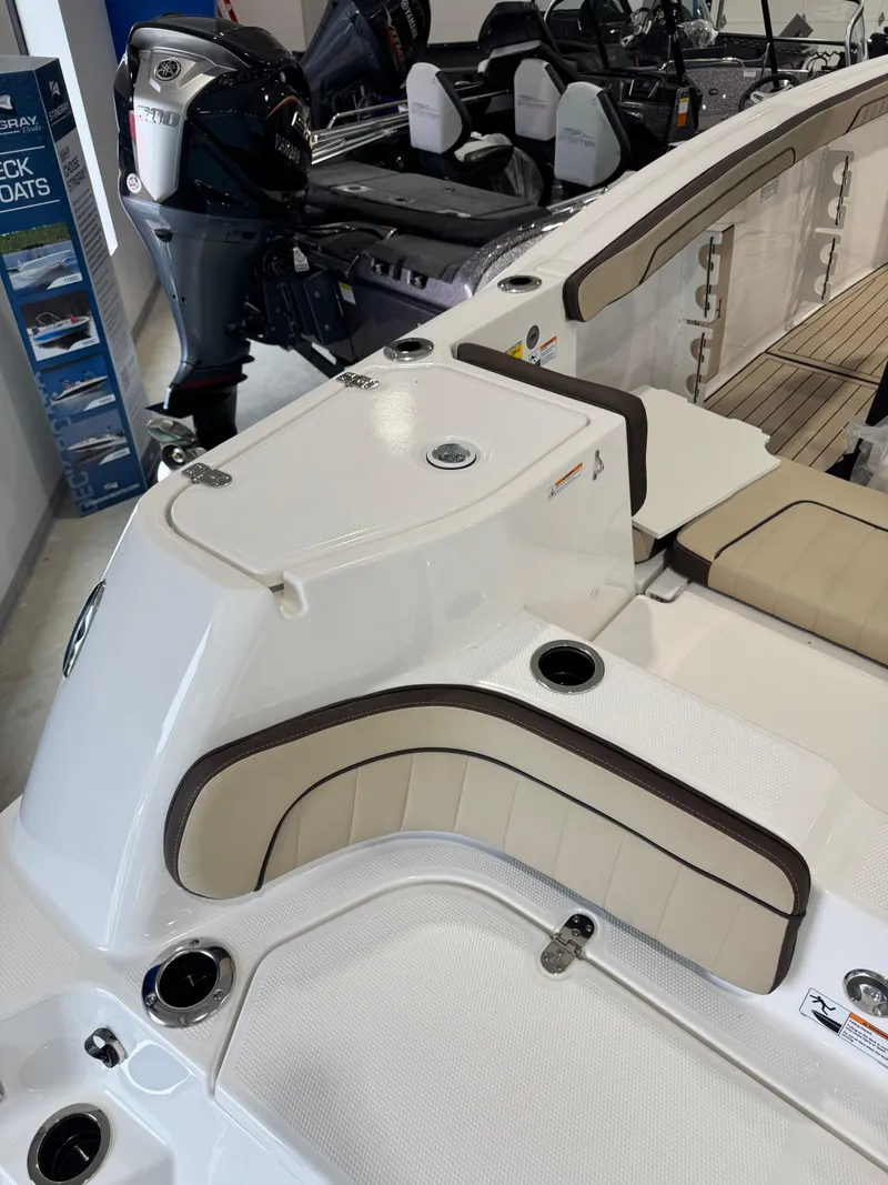 Slide: The Image of 2025 Yamaha Boats 255 FSH Sport E interior with seating and motor details. - 4