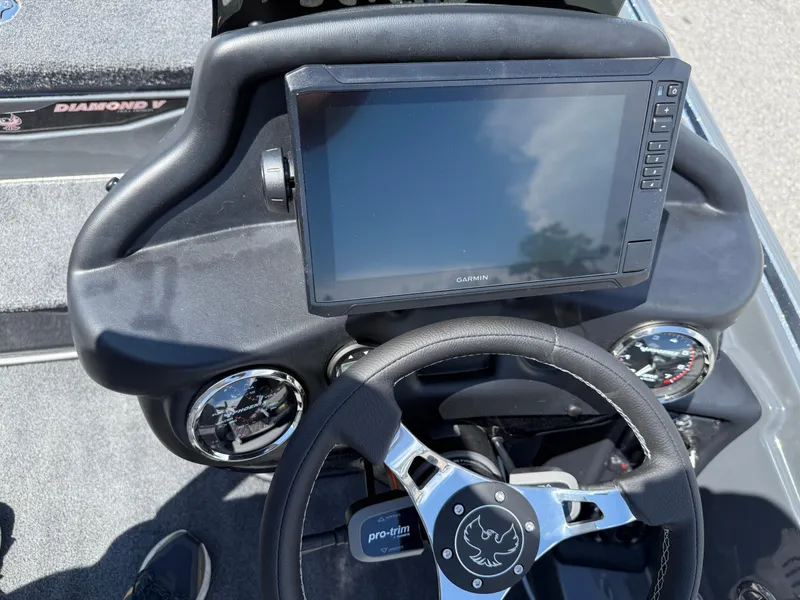 Slide: The Image of 2026 Phoenix 721 ZXL boat dashboard with Garmin display and steering wheel. - 15