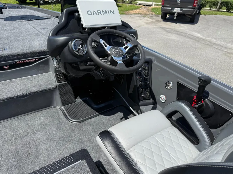 Slide: The Image of 2026 Phoenix 721 ZXL boat interior with Garmin display and steering wheel. - 16