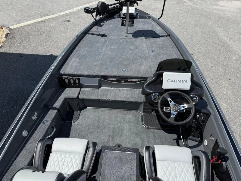 Slide: The Image of 2026 Phoenix 721 ZXL boat interior with Garmin navigation system and dual seating. - 17