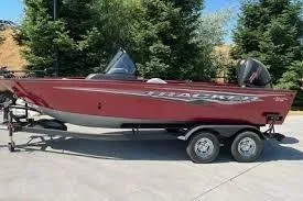 The Image of 2025 Tracker Targa V-19 WT boat on trailer, parked outdoors. - 0
