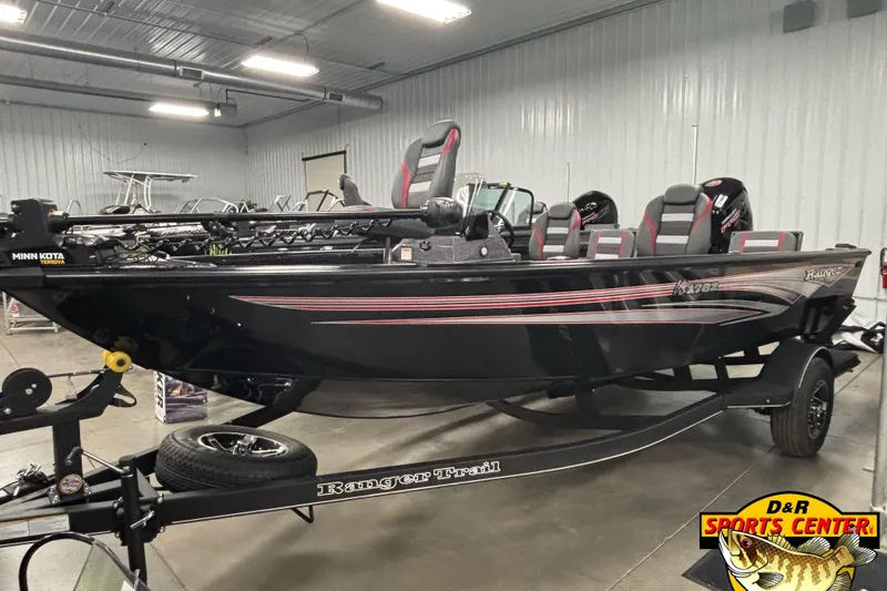 The Image of 2025 Ranger VS1782SC Reata boat in showroom, black with red accents, on trailer. - 0