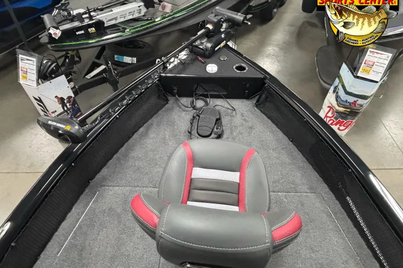 Slide: The Image of 2025 Ranger VS1782SC Reata boat interior with gray and red seating, trolling motor, and fishing gear. - 5