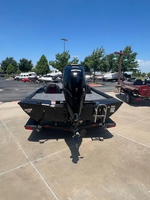 Slide: The Image of 2025 Ranger RT188 boat on trailer, rear view, parked outdoors on sunny day. - 3