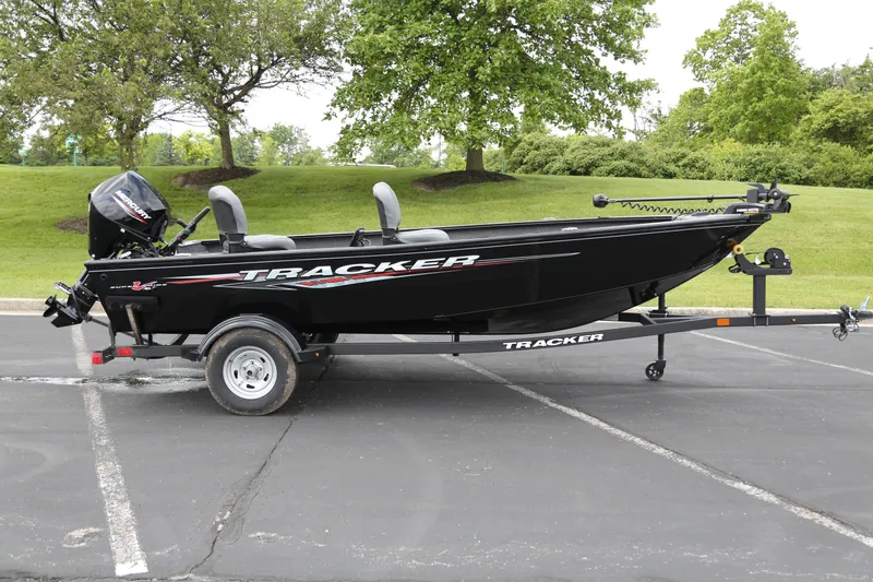 The Image of 2025 Tracker Super Guide V-16 T boat on trailer in parking lot. - 0