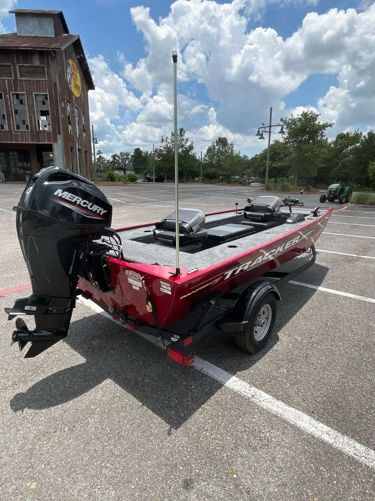 Slide: The Image of 2025 Tracker Panfish 17 boat with Mercury engine in parking lot. - 3