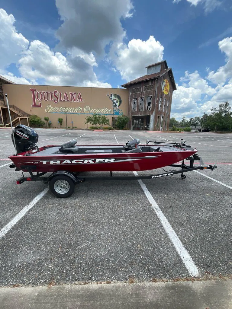 Slide: The Image of 2025 Tracker Panfish 17 boat in parking lot, Louisiana Sportsman's Paradise backdrop. - 4