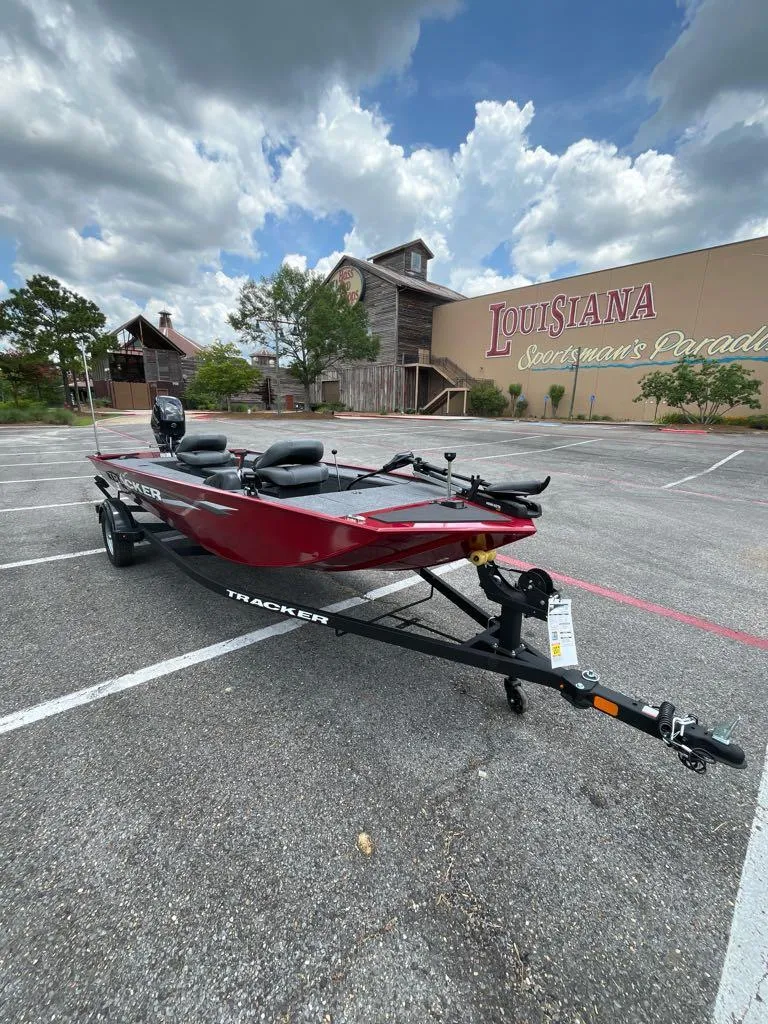 Slide: The Image of 2025 Tracker Panfish 17 boat in parking lot, Louisiana Sportsman's Paradise backdrop. - 5