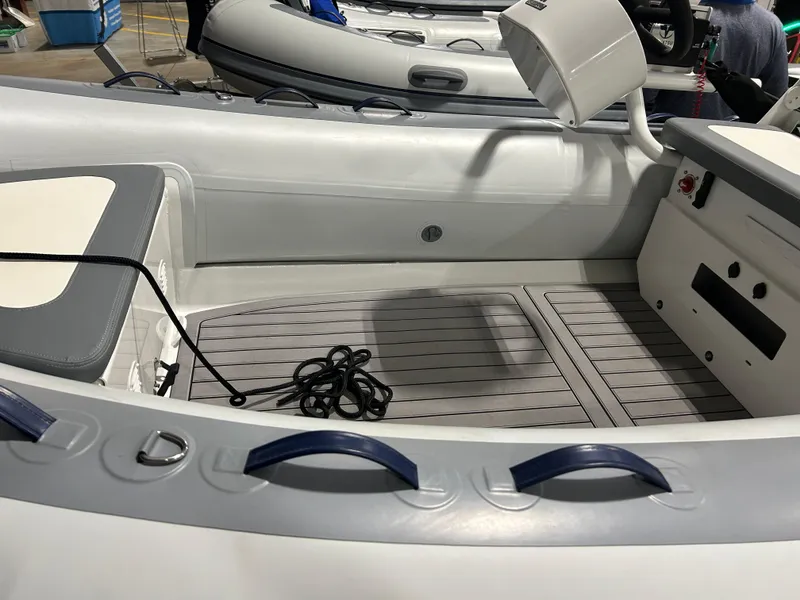 Slide: The Image of 2025 Highfield Classic 400 boat interior with seating and steering console. - 10