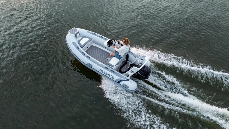 Slide: The Image of 2025 Highfield Classic 400 boat cruising on water, viewed from above. - 4