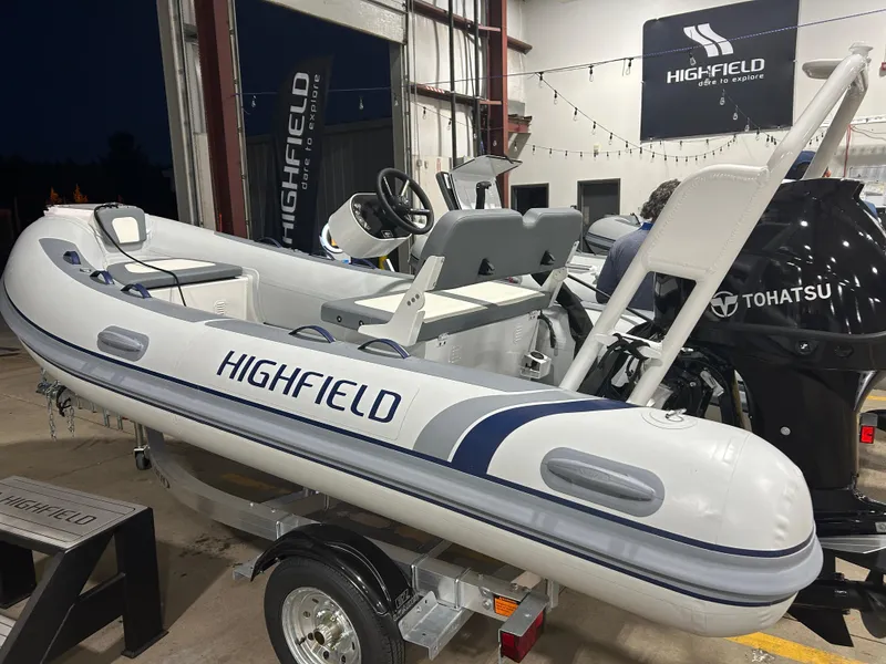 Slide: The Image of 2025 Highfield Classic 400 inflatable boat with Tohatsu engine in showroom. - 8