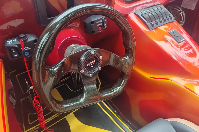 Slide: The Image of 2024 Watersports Car SERIES-L interior with carbon fiber steering wheel and control panel. - 3