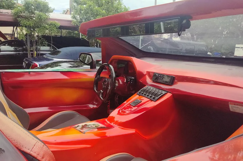 Slide: The Image of 2024 Watersports Car SERIES-L interior with vibrant red dashboard and modern controls. - 4