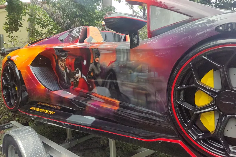 Slide: The Image of 2024 Watersports Car SERIES-L with vibrant custom artwork and sleek design. - 5