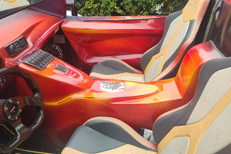 Slide: The Image of 2024 Watersports Car SERIES-L interior with vibrant red and orange design, modern controls, and sporty seats. - 6