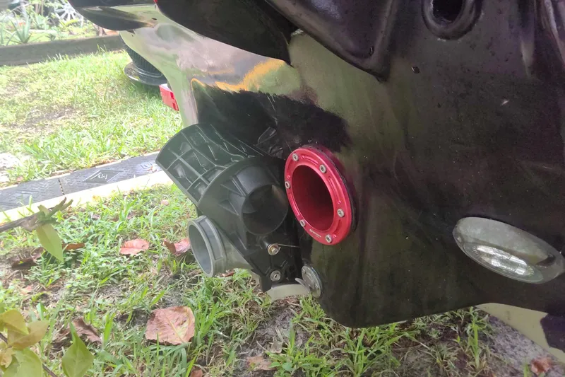 Slide: The Image of 2024 Watersports Car SERIES-L rear detail with red and black components. - 8