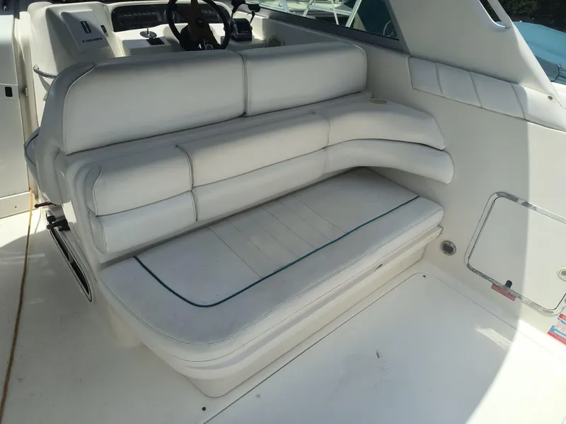 Slide: The Image of White seating area on 1995 Sea Ray 330 Sundancer boat. - 6
