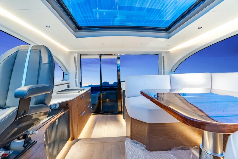 Slide: The Image of Luxurious interior of 2025 ECLIPSE 505 Shadow yacht with panoramic windows and modern seating. - 10