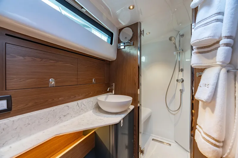 Slide: The Image of Luxurious bathroom in 2025 ECLIPSE 505 Shadow yacht, featuring modern fixtures and elegant wood accents. - 15
