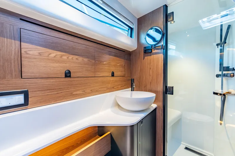 Slide: The Image of Modern bathroom interior in 2025 ECLIPSE 505 Shadow yacht, featuring sleek wood and glass design. - 16