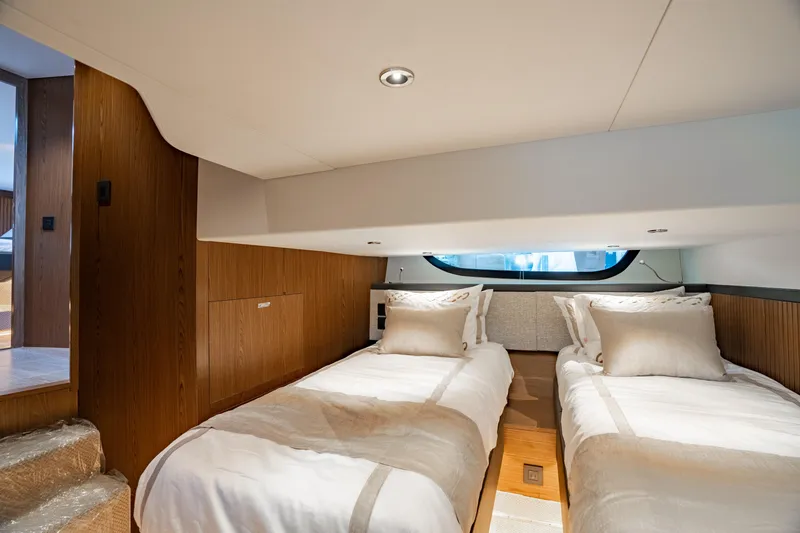 Slide: The Image of Luxurious cabin interior of 2025 ECLIPSE 505 Shadow yacht with twin beds. - 18