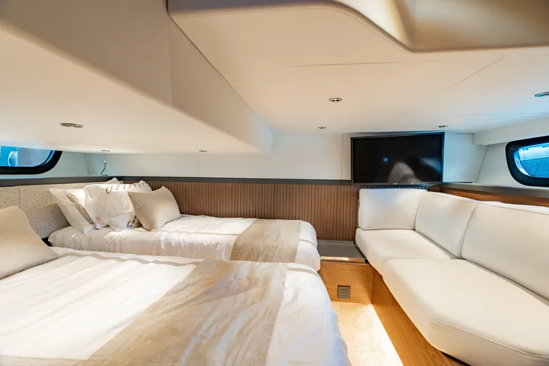 Slide: The Image of Luxurious interior of 2025 ECLIPSE 505 Shadow yacht with twin beds and modern decor. - 19
