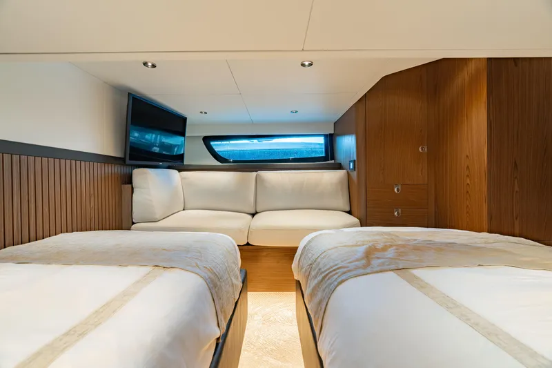 Slide: The Image of Luxurious interior of 2025 ECLIPSE 505 Shadow yacht with twin beds and modern decor. - 20