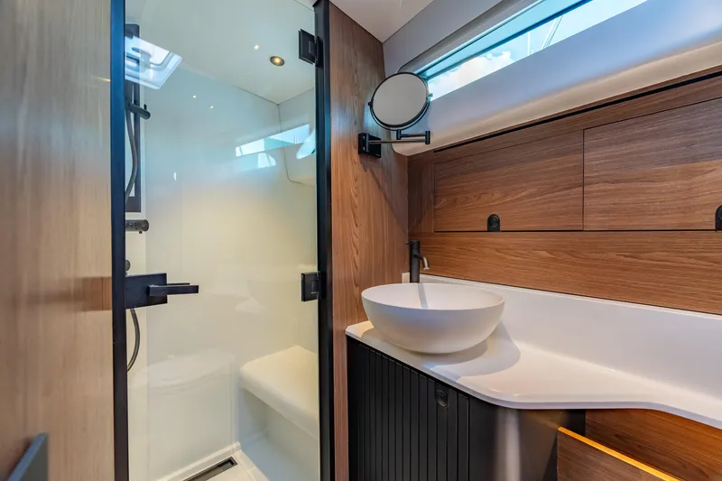 Slide: The Image of Modern bathroom in 2025 ECLIPSE 505 Shadow yacht with sleek design and wooden accents. - 21