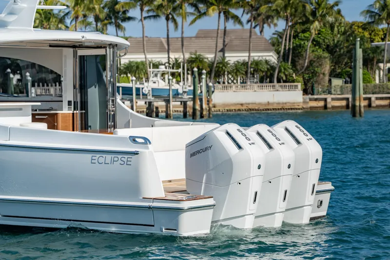 Slide: The Image of Luxury Eclipse 505 Shadow yacht with powerful Mercury outboard engines, cruising in tropical waters. - 28