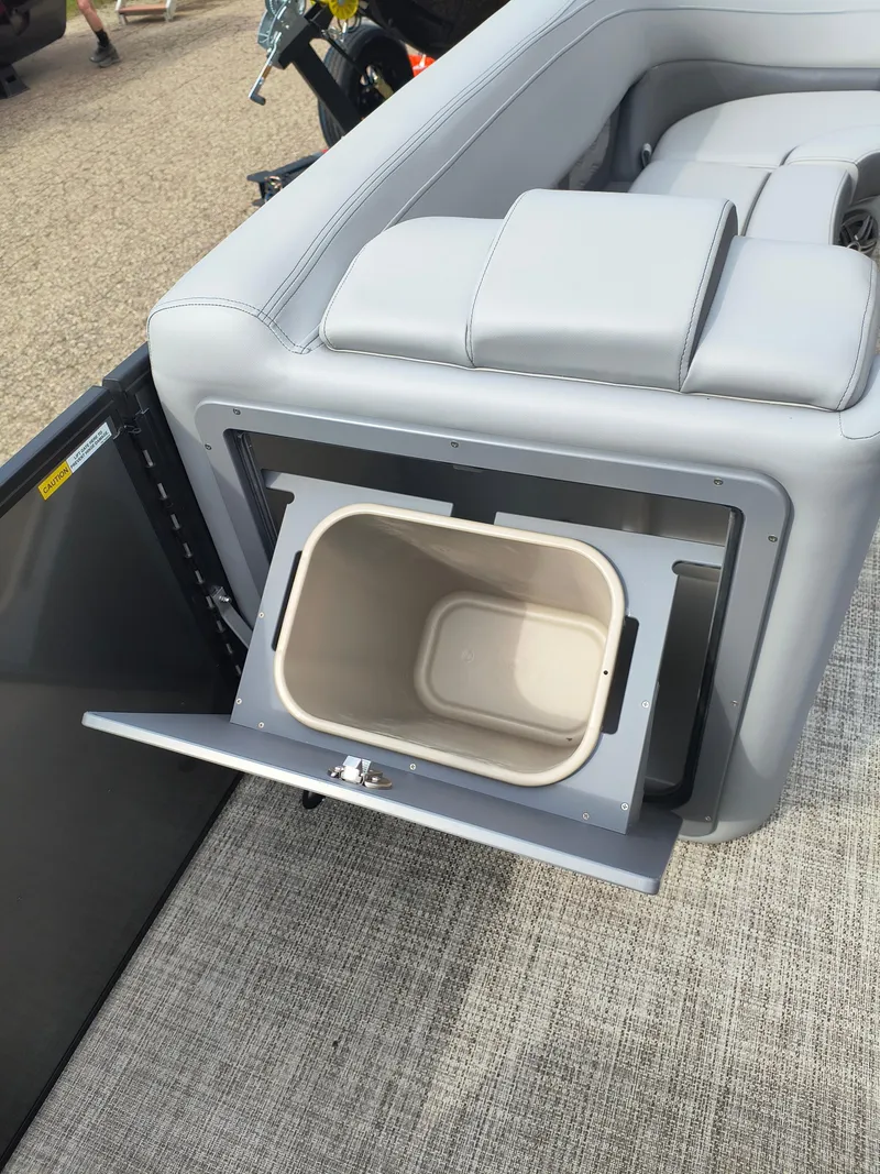 Slide: The Image of SunCatcher Fusion 322C 2025 boat with built-in storage compartment and removable bin. - 12