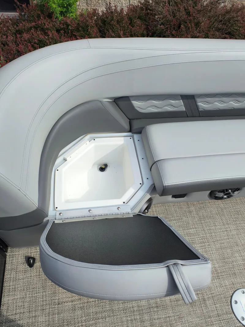 Slide: The Image of SunCatcher Fusion 322C 2025 boat seat with open storage compartment, gray upholstery. - 18